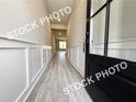 Stylish entryway with wainscoting and hardwood flooring, creating an inviting ambiance at 5722 Urban Village Way # 8, Tucker, GA 30084