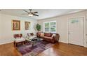 Bright living room with hardwood floors, natural light, and comfortable seating area at 3344 Ridgecrest Dr, Powder Springs, GA 30127