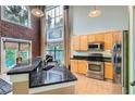 Well-equipped kitchen with stainless steel appliances and granite countertops, perfect for cooking and entertaining at 791 Wylie Se St # 410, Atlanta, GA 30316