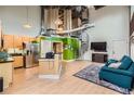 Open-concept living area showcasing a spiral staircase, modern kitchen, and bright, natural light at 791 Wylie Se St # 410, Atlanta, GA 30316