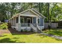 Craftsman-style home features a covered front porch, walkway, and a well-maintained lawn at 23 Clifton Ne St, Atlanta, GA 30317