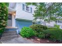 Home's front entrance shows well-kept landscaping, charming details like the painted brick and stone steps at 2592 Dresden Dr, Atlanta, GA 30341