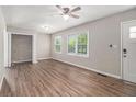 Bright living room with hardwood floors, fresh paint, and updated fixtures at 3456 Maryvale Dr, Decatur, GA 30032