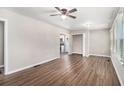 Open floor plan living room with modern ceiling fan and hardwood floors at 3456 Maryvale Dr, Decatur, GA 30032