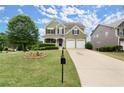 Beautifully landscaped front yard with mature trees enhance this two-story home's curb appeal at 216 Toonigh Way, Canton, GA 30115