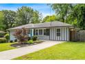 Beautiful view of the home's exterior with a well-maintained lawn and landscaping at 3153 Bonway Dr, Decatur, GA 30032