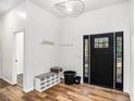 Welcoming foyer with hardwood floors, a modern door, and storage at 3444 Underwood Se Ct, Conyers, GA 30013