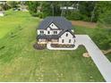 Aerial view of a sprawling property showcasing the home's placement and long driveway at 2339 Eastwood Dr, Snellville, GA 30078