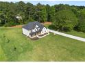 An elevated shot displays the home's roof, ample lawn space, and surrounding trees at 2339 Eastwood Dr, Snellville, GA 30078