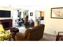 Inviting living room featuring a cozy fireplace and lots of natural light at 9400 Roberts Dr # 7M, Atlanta, GA 30350