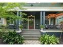 Inviting home with covered porch and beautiful plants and shrubs in front yard at 541 Greenwood Ne Ave, Atlanta, GA 30308