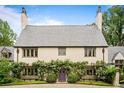 Charming home features a lovely garden surrounding the arched, purple front door at 675 W Paces Ferry Nw Rd # 11, Atlanta, GA 30327