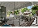 Relaxing front porch with a swing, offering an ideal spot to unwind and enjoy the outdoors at 206 Flora Ne Ave, Atlanta, GA 30307