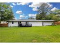 A well-maintained backyard features a black deck, perfect for relaxing or entertaining outdoors at 4166 Idlevale Dr, Tucker, GA 30084