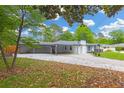 Side view of renovated single-story house with covered parking, offering practicality and enhanced curb appeal at 4166 Idlevale Dr, Tucker, GA 30084