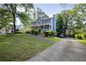 Stylish two-story house with a welcoming front porch and a long private driveway at 1491 Kolb Ridge Sw Dr, Marietta, GA 30008