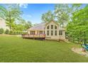 Expansive backyard with a deck and lush greenery at 2333 Orion Ct, Grayson, GA 30017