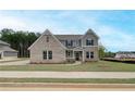 Charming two-story home with brick and siding exterior and well-maintained front yard at 234 Linford Dr, Locust Grove, GA 30248
