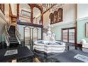Stunning lobby with water feature, stairs, and elevator access in upscale condo building at 3334 Peachtree Ne Rd # 101, Atlanta, GA 30326