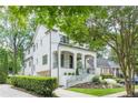 Angle view of an exterior showcasing landscaping, stone driveway and a glimpse of surrounding neighborhood at 1211 Reeder Ne Cir, Atlanta, GA 30306