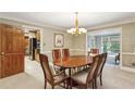 Elegant dining room with hardwood floors, a chandelier, and classic decor at 3298 Robinson Oaks Ne Way, Marietta, GA 30062