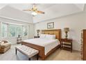 Serene main bedroom with tray ceiling, bay window, and a comfortable sitting area at 3298 Robinson Oaks Ne Way, Marietta, GA 30062