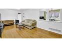 Bright living room showcasing hardwood floors, neutral decor, and an open view to a dining area at 1192 Pathfinder Rd, Marietta, GA 30066