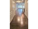 View of a hardwood floor entryway into an open living and kitchen area at 2514 Norwood Park Crossing, Doraville, GA 30340