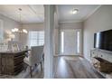 Inviting entryway with hardwood floors, modern lighting, and a view of the adjacent dining room at 200 Eva Way Ne, Cartersville, GA 30121