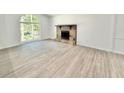 A bright living room is enhanced by a decorative fireplace and large windows at 8399 Lake Dr, Snellville, GA 30039