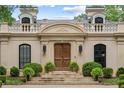 Detailed shot of the front exterior showcasing the architectural details, lighting and landscaping at 3212 Arden Nw Rd, Atlanta, GA 30305