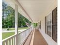 Spacious covered front porch provides ample room to relax and enjoy the outdoors at 37 Winesap Ct, Temple, GA 30179