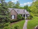 Attractive home with stone facade, landscaped front yard and a curved walkway at 6125 Fouts Mill Rd, Douglasville, GA 30135