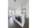 Clean, bright kitchen with white cabinets, a large island with microwave, and stainless steel appliances at 1740 Langston Sw Ave, Atlanta, GA 30310