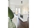Bright, modern kitchen featuring a large island with microwave and sleek white cabinets at 1740 Langston Sw Ave, Atlanta, GA 30310
