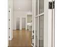 Welcoming foyer showcasing hardwood floors and a clear view through to the kitchen, with an open-concept design at 515 Godfrey Dr, Cumming, GA 30040
