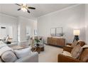 Inviting living room featuring neutral decor, French doors, and comfortable seating at 515 Godfrey Dr, Cumming, GA 30040