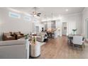Spacious open-concept living space with living room, dining, and modern kitchen at 515 Godfrey Dr, Cumming, GA 30040