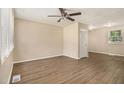 Neutral living room with newer hard wood floors, ceiling fan, and a classic design at 442 Cologne Se Dr, Atlanta, GA 30354