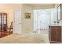 Bright foyer with hardwood and carpet floors and a view of the front door at 2606 Fairmont Park Ct, Dacula, GA 30019