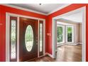 Inviting foyer featuring a decorative glass front door and hardwood floors at 491 Hemlock Sw Dr, Marietta, GA 30064