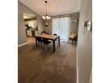 Stylish dining area adjacent to the kitchen with modern lighting and a view of the kitchen at 1736 Almand Creek Sw Dr, Conyers, GA 30094