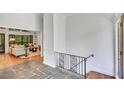 Open-concept living area showcasing stairs, stone floors, and hardwood leading to a bright, comfortable space at 3270 Leslie Ne Ct, Atlanta, GA 30345