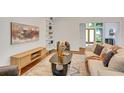 Stylish living room with modern decor, wood floors, decorative shelving, and large windows at 3270 Leslie Ne Ct, Atlanta, GA 30345