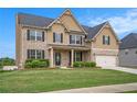 Charming two-story brick home with well-maintained lawn and landscaping at 113 Osier Dr, Mcdonough, GA 30252
