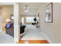 Spacious living room features plush carpeting, a brick fireplace, vaulted ceilings, and ample natural light at 4217 Brentwood Dr, Buford, GA 30518