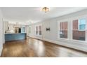 Open living space with hardwood floors flowing into a modern kitchen, offering seamless entertaining at 308 Mcpherson Se Pl, Atlanta, GA 30316