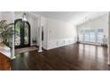 Spacious living room featuring dark hardwood floors and elegant decor at 3335 Ashton Dr, Suwanee, GA 30024