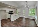 Bright eat-in kitchen with white cabinetry, stainless steel appliances, and a breakfast bar at 3445 Huntington Ct, Douglasville, GA 30134