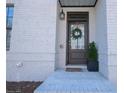 Close up of a charming front door entrance with classic hardware and decorative wreath at 3611 Ridgeway Rd, Duluth, GA 30096